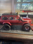 Horizon Hobby Red Remote-controlled Off-road Car With Roof Rack & Large Tires. Fixed Price $100.00.