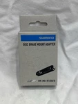 Shimano Disc Brake Mount Adapter SM-MA-R160D/D New. Fixed Price $10.00.