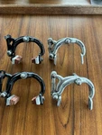2 Sets Vintage Universal Super 68 Brake Calipers One Black Silver. Fixed Price $48.00.